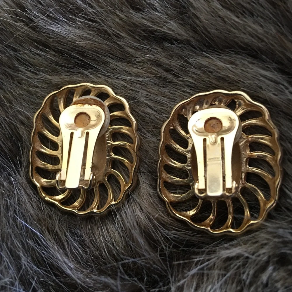 Vintage gold tone swirl blue enamel clip earrings